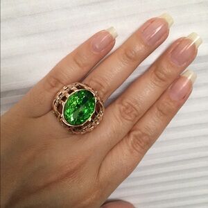 YG SS ring with green oval Austrian Crystal